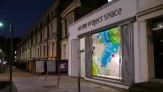 ACME Project Space, London with large vinyl installation of color coded Lunar map.